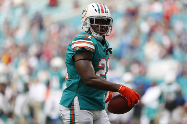 Miami Dolphins running back Frank Gore (21) warms up, before an NFL football game against the New England Patriots, Sunday, Dec. 9, 2018, in Miami Gardens, Fla. (AP Photo/Wilfredo Lee)