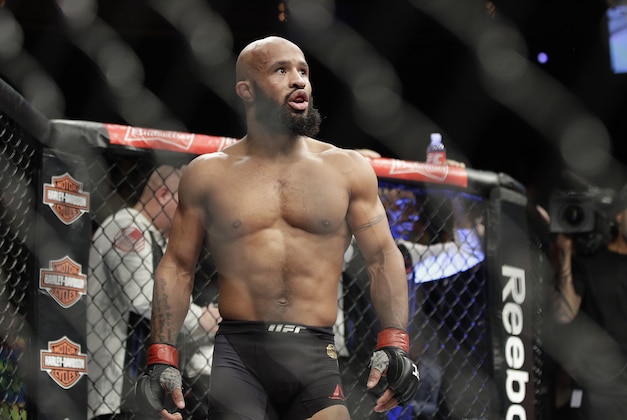 FILE - In this Saturday, Dec. 3, 2016 file photo, Demetrious Johnson reacts after defeating Tim Elliott during a mixed martial arts flyweight bout in Las Vegas. Demetrious Johnson chasing an unprecedented 11th title defense and a headline fight that could decide Conor McGregor’s next opponent top a UFC 216 card set for Saturday, Oct. 7, 2017 in Las Vegas, an event playing out in a city still reeling from a mass shooting in which 58 people were killed and nearly 500 were injured. (AP Photo/John Locher, File)