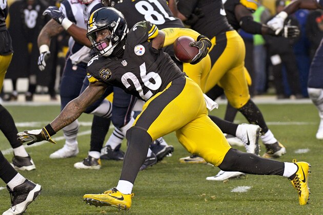 FILE - This file photo from Dec. 17, 2017, Pittsburgh Steelers running back Le'Veon Bell (26) as he runs the ball against the New England Patriots during the first half of an NFL football game in Pittsburgh. The running back is fresh heading into Sunday's playoff game against Jacksonville. Bell only had 15 carries in the teams' first meeting this season. (AP Photo/Don Wright, FILE)