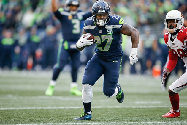 SEATTLE, WA - DECEMBER 30: Mike Davis #27 of the Seattle Seahawks runs the ball for a touchdown in the third quarter against the Arizona Cardinals at CenturyLink Field on December 30, 2018 in Seattle, Washington. (Photo by Otto Greule Jr/Getty Images)
