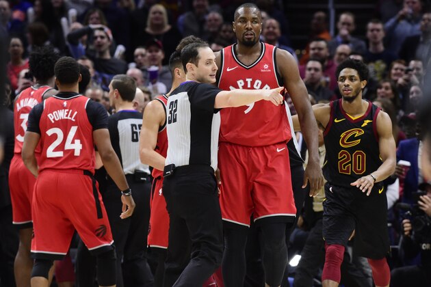 CLEVELAND, OHIO - MARCH 11: Referee Marat Kogut #32 directs Serge Ibaka #9 of the Toronto Raptors to the bench after he fought with Marquese Chriss #3 of the Cleveland Cavaliers during the second half at Quicken Loans Arena on March 11, 2019 in Cleveland, Ohio. The Cavaliers defeated the Raptors 126-101. NOTE TO USER: User expressly acknowledges and agrees that, by downloading and or using this photograph, User is consenting to the terms and conditions of the Getty Images License Agreement. (Photo by Jason Miller/Getty Images)