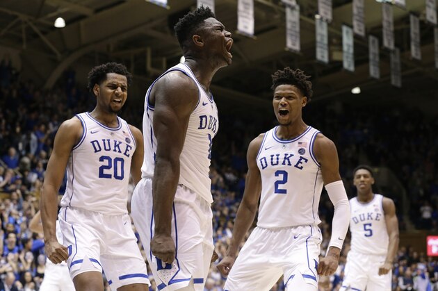 Duke's Zion Williamson, center, reacts with Marques Bolden (20), Cam Reddish (2) and RJ Barrett (5) following a play against St. John's during the second half of an NCAA college basketball game in Durham, N.C., Saturday, Feb. 2, 2019. Duke won 91-61. (AP Photo/Gerry Broome)