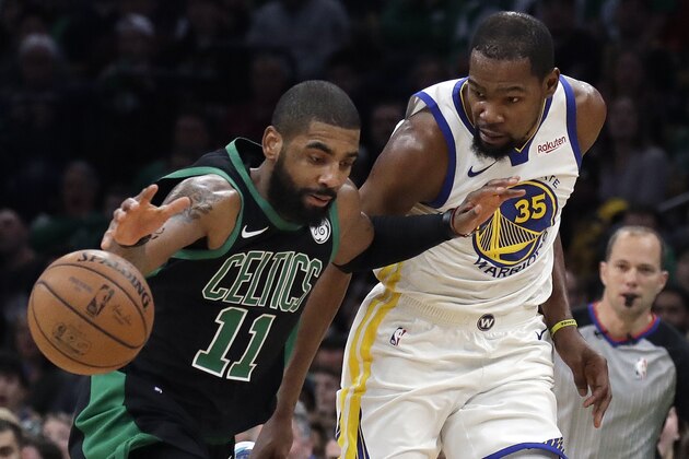 Boston Celtics guard Kyrie Irving (11) dribbles against Golden State Warriors forward Kevin Durant (35) in the first quarter of an NBA basketball game, Saturday, Jan. 26, 2019, in Boston. (AP Photo/Elise Amendola)