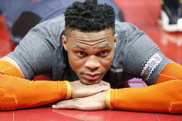 Oklahoma City Thunder guard Russell Westbrook looks on as he is stretched before the start of their NBA basketball game against the Utah Jazz Monday, March 11, 2019, in Salt Lake City. (AP Photo/Rick Bowmer)