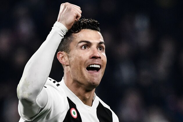 Juventus' Portuguese forward Cristiano Ronaldo celebrates after scoring 2-0 during the UEFA Champions League round of 16 second-leg football match Juventus vs Atletico Madrid on March 12, 2019 at the Juventus stadium in Turin. (Photo by Marco BERTORELLO / AFP)        (Photo credit should read MARCO BERTORELLO/AFP/Getty Images)