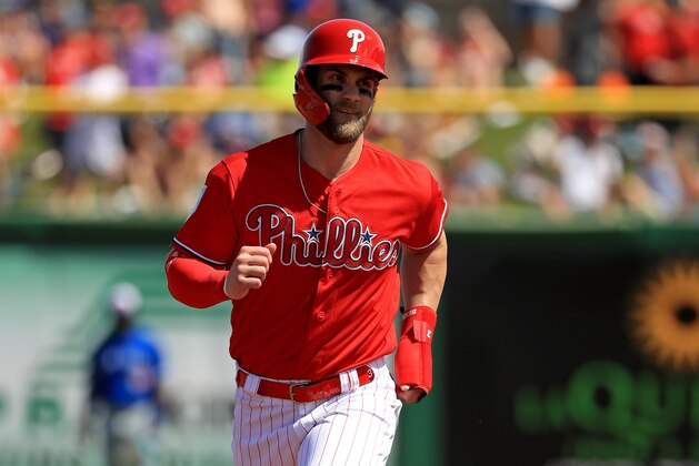 CLEARWATER, FLORIDA - MARCH 09: Bryce Harper #3  scores on a two run home run in the first inning by Rhys Hoskins #17 of the Philadelphia Phillies during a game against the Toronto Blue Jays on March 09, 2019 in Clearwater, Florida. (Photo by Mike Ehrmann/Getty Images)