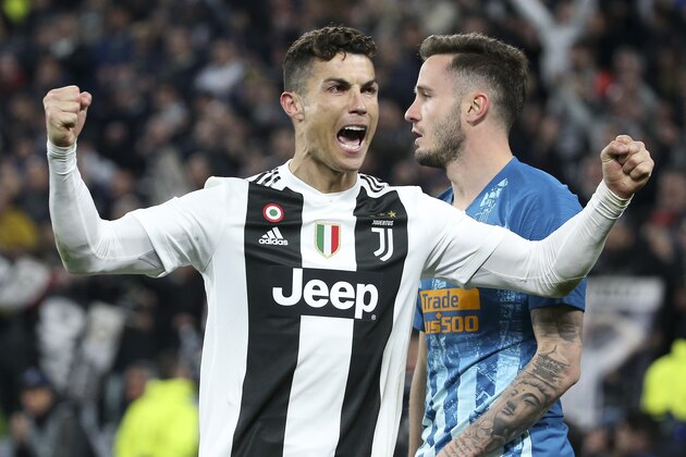 TURIN, ITALY - MARCH 12: Cristiano Ronaldo of Juventus celebrates the victory at final whistle while Saul Niguez of Atletico Madrid is dejected following the UEFA Champions League Round of 16 Second Leg match between Juventus and Club de Atletico Madrid at Allianz Stadium on March 12, 2019 in Turin, Italy. (Photo by Jean Catuffe/Getty Images)