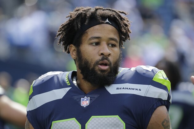 Seattle Seahawks free safety Earl Thomas stands on the field during warmups before an NFL football game against the Dallas Cowboys, Sunday, Sept. 23, 2018, in Seattle. (AP Photo/Elaine Thompson)