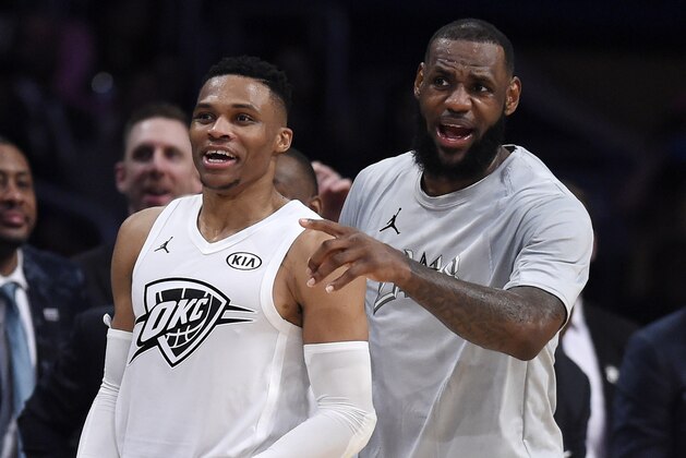 Team LeBron's Russell Westbrook, left, of the Oklahoma City Thunder, and Team LeBron's LeBron James, of the Cleveland Cavaliers, cheer from the bench during the first half of an NBA All-Star basketball game against Team , Sunday, Feb. 18, 2018, in Los Angeles. (AP Photo/Chris Pizzello)