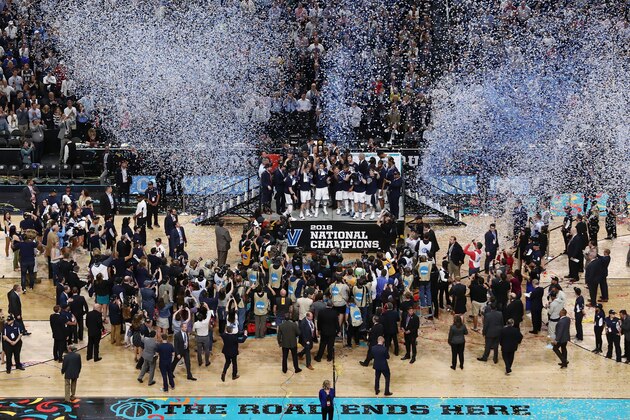 SAN ANTONIO, TX - APRIL 02:  Jalen Brunson #1 of the Villanova Wildcats raises the trophy and celebrates with his teammates after defeating the Michigan Wolverines during the 2018 NCAA Men's Final Four National Championship game at the Alamodome on April 2, 2018 in San Antonio, Texas.  Villanova defeated Michigan 79-62.  (Photo by Ronald Martinez/Getty Images)
