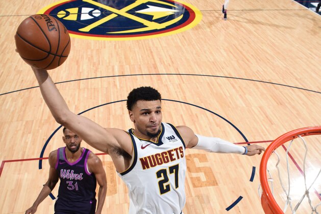 DENVER, CO - MARCH 12: Jamal Murray #27 of the Denver Nuggets dunks the ball against the Minnesota Timberwolves on March 12, 2019 at the Pepsi Center in Denver, Colorado. NOTE TO USER: User expressly acknowledges and agrees that, by downloading and/or using this photograph, user is consenting to the terms and conditions of the Getty Images License Agreement. Mandatory Copyright Notice: Copyright 2019 NBAE (Photo by Garrett Ellwood/NBAE via Getty Images)