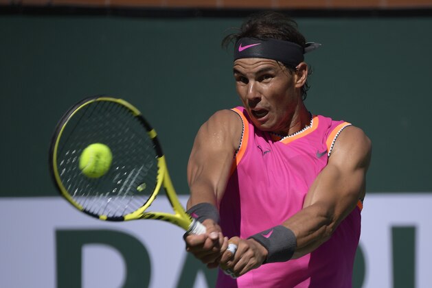 Rafael Nadal, of Spain, returns a shot to Diego Schwartzman at the BNP Paribas Open tennis tournament Tuesday, March 12, 2019 in Indian Wells, Calif. (AP Photo/Mark J. Terrill)