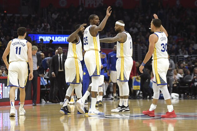 Golden State Warriors' Klay Thompson, Draymond Green, Kevin Durant, DeMarcus Cousins and Stephen Curry, from left, celebrate during the second half of the team's NBA basketball game against the Los Angeles Clippers on Friday, Jan. 18, 2019, in Los Angeles. The Warriors won 112-94. (AP Photo/Mark J. Terrill)