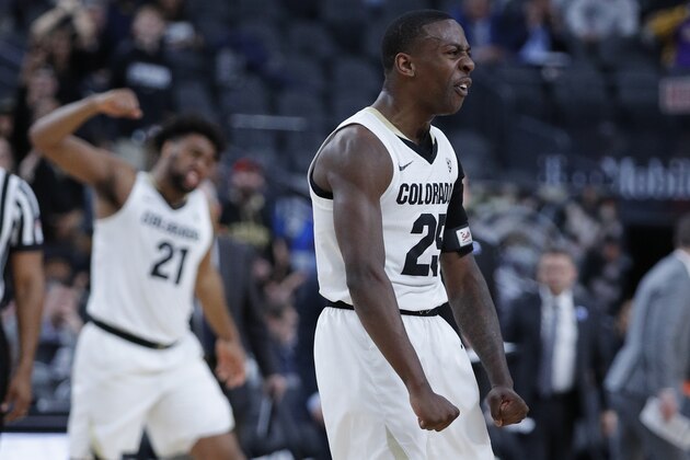 Colorado's McKinley Wright IV celebrates after a play against California during the first half of an NCAA college basketball game in the first round of the Pac-12 men's tournament Wednesday, March 13, 2019, in Las Vegas. (AP Photo/John Locher)