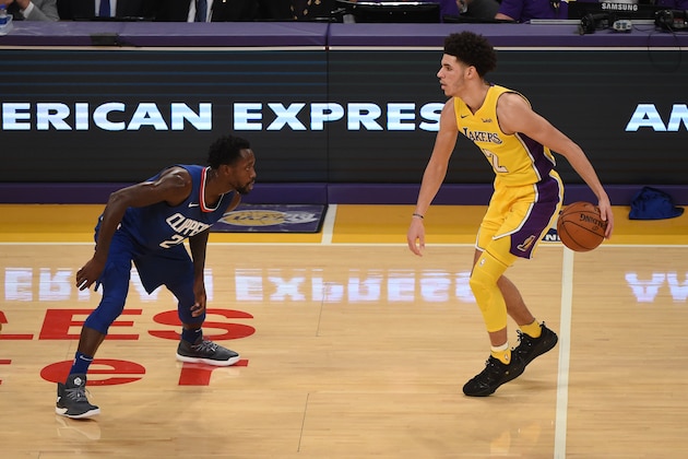LOS ANGELES, CA - OCTOBER 19:  Lonzo Ball #2 of the Los Angeles Lakers dribbles the ball against Patrick Beverley #21 of the LA Clippers on October 19, 2017 at STAPLES Center in Los Angeles, California. NOTE TO USER: User expressly acknowledges and agrees that, by downloading and/or using this Photograph, user is consenting to the terms and conditions of the Getty Images License Agreement. Mandatory Copyright Notice: Copyright 2017 NBAE (Photo by Adam Pantozzi/NBAE via Getty Images)