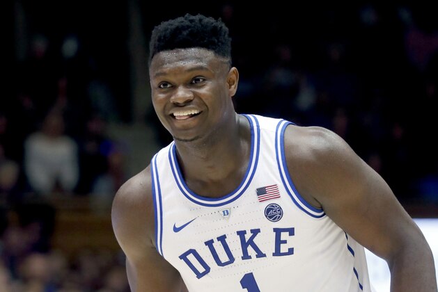 Duke's Zion Williamson (1) flashes a grin after his team made a play against North Carolina State during the second half of an NCAA college basketball game in Durham, N.C., Saturday, Feb. 16, 2019. (AP Photo/Chris Seward)