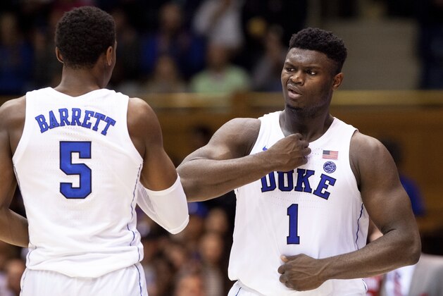 Duke's Zion Williamson (1) and Duke's RJ Barrett (5) thump their chests late in the second half of an NCAA college basketball game against Hartford in Durham, N.C., Wednesday, Dec. 5, 2018. (AP Photo/Ben McKeown)