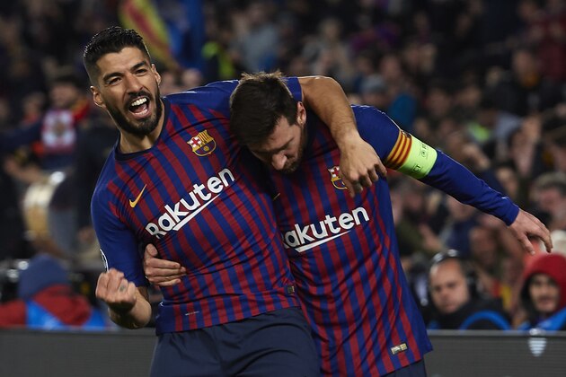 BARCELONA, SPAIN - MARCH 13: Lionel Messi of FC Barcelona celebrates after scoring his team's third goal with his teammate Luis Suarez during the UEFA Champions League Round of 16 Second Leg match between FC Barcelona and Olympique Lyonnais at Nou Camp on March 13, 2019 in Barcelona, Spain. (Photo by Quality Sport Images/Getty Images)