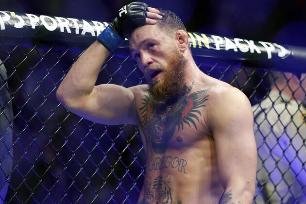 FILE - In this Oct. 6, 2018, file photo, Conor McGregor reacts after losing to Khabib Nurmagomedov in a lightweight title mixed martial arts bout at UFC 229 in Las Vegas. Nurmagomedov was fined $500,000 and suspended for nine months for a brawl inside and outside the octagon after his fight with Conor McGregor at UFC 229. McGregor was fined $50,000 and suspended for six months.  The suspensions for both fighters are retroactive to Oct. 6. (AP Photo/John Locher, File)