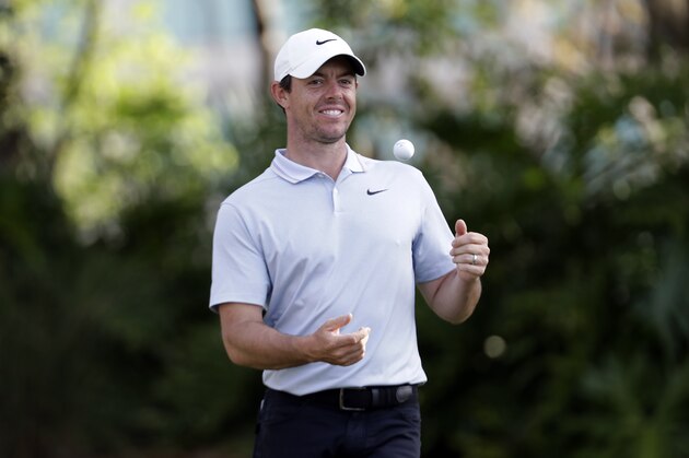 Rory McIlroy, of Northern Ireland, tosses his ball into the air on the 13th tee during the first round of The Players Championship golf tournament Thursday, March 14, 2019, in Ponte Vedra Beach, Fla. (AP Photo/Lynne Sladky)