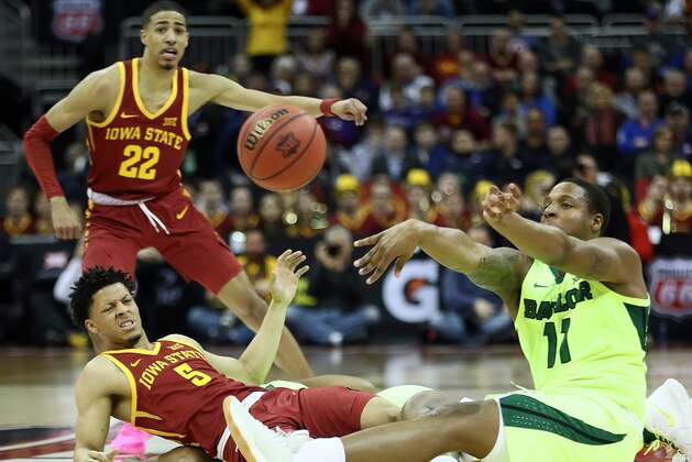 KANSAS CITY, MISSOURI - MARCH 14:  Mark Vital #11 of the Baylor Bears passes over Lindell Wigginton #5 of the Iowa State Cyclones after recovering a loose ball during the quarterfinal game of the Big 12 Basketball Tournament at Sprint Center on March 14, 2019 in Kansas City, Missouri. (Photo by Jamie Squire/Getty Images)