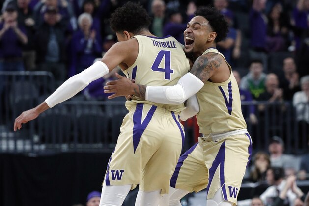 Washington's David Crisp, right, and Matisse Thybulle celebrate during the second half of an NCAA college basketball game against Southern California in the quarterfinal round of the Pac-12 men's tournament Thursday, March 14, 2019, in Las Vegas. (AP Photo/John Locher)