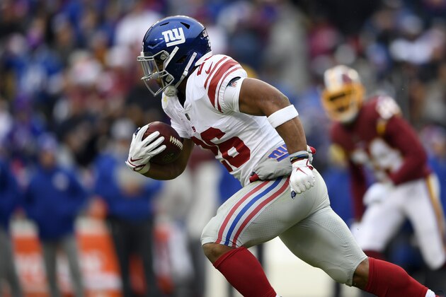 New York Giants running back Saquon Barkley (26) runs for a 78-yard touchdown during the first half of an NFL football game against the Washington Redskins, Sunday, Dec. 9, 2018, in Landover, Md. (AP Photo/Nick Wass)