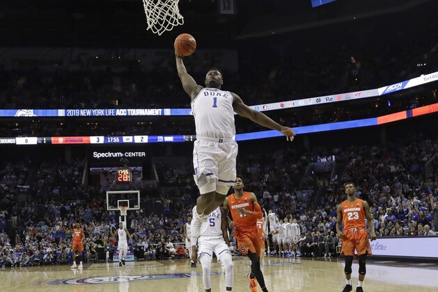 Duke's Zion Williamson (1) goes up to dunk against Syracuse during the first half of an NCAA college basketball game in the Atlantic Coast Conference tournament in Charlotte, N.C., Thursday, March 14, 2019. (AP Photo/Chuck Burton)