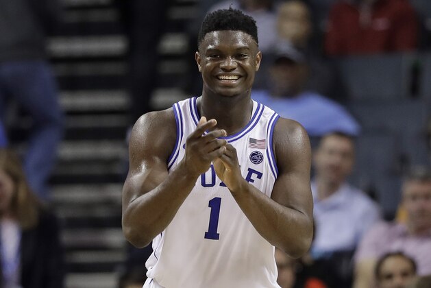 Duke's Zion Williamson (1) smiles after a play against Syracuse during the second half of an NCAA college basketball game in the Atlantic Coast Conference tournament in Charlotte, N.C., Thursday, March 14, 2019. (AP Photo/Chuck Burton)