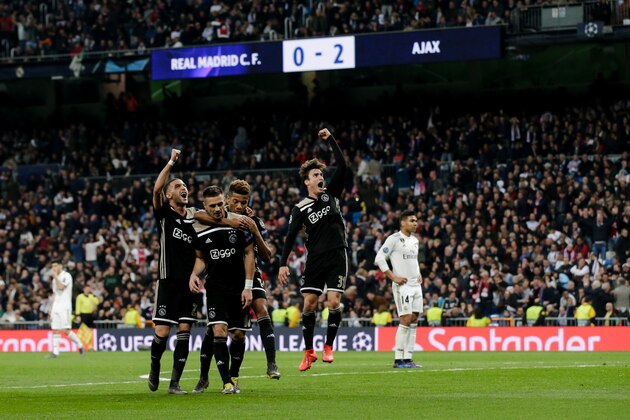 MADRID, SPAIN - MARCH 5: (L-R) Hakim Ziyech of Ajax, Dusan Tadic of Ajax, David Neres of Ajax, Nicolas Tagliafico of Ajax, celebrates 0-3 during the UEFA Champions League  match between Real Madrid v Ajax at the Santiago Bernabeu on March 5, 2019 in Madrid Spain (Photo by Erwin Spek/Soccrates/Getty Images)