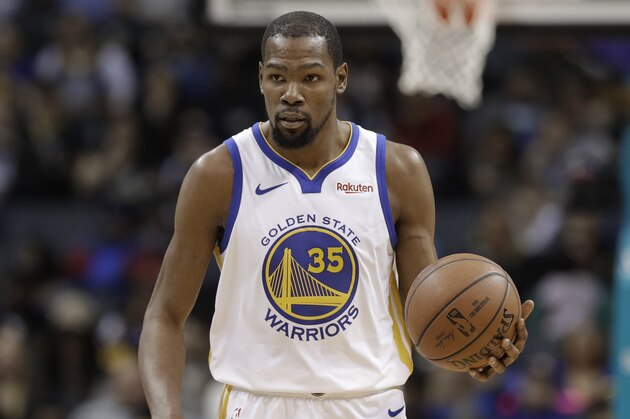 Golden State Warriors' Kevin Durant (35) brings the ball up court during the second half of an NBA basketball game against the Charlotte Hornets in Charlotte, N.C., Monday, Feb. 25, 2019. (AP Photo/Chuck Burton)