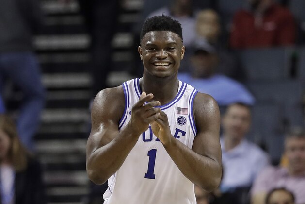 Duke's Zion Williamson (1) smiles after a play against Syracuse during the second half of an NCAA college basketball game in the Atlantic Coast Conference tournament in Charlotte, N.C., Thursday, March 14, 2019. (AP Photo/Chuck Burton)