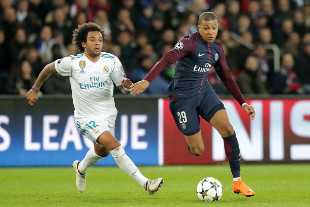 PARIS, FRANCE - MARCH 06: Kylian Mbappe of Paris Saint Germain and Marcelo of Real Madrid in action during the UEFA Champions League Round of 16 Second Leg match between Paris Saint-Germain and Real Madrid at Parc des Princes on March 6, 2018 in Paris, France.  (Photo by Romain Perrocheau/Getty Images)