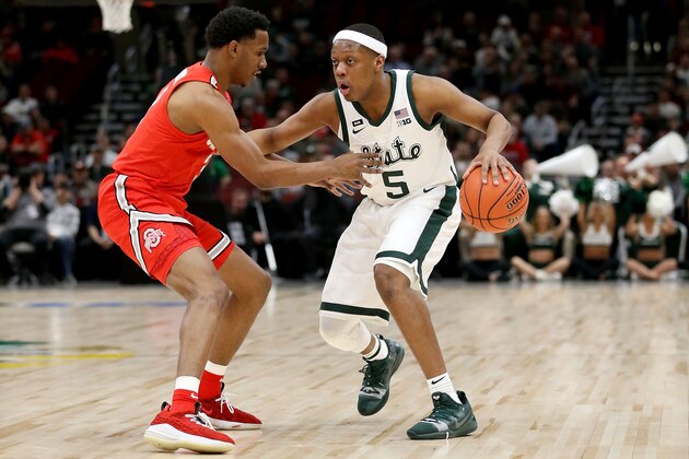 CHICAGO, ILLINOIS - MARCH 15:  Cassius Winston #5 of the Michigan State Spartans dribbles the ball while being guarded by C.J. Jackson #3 of the Ohio State Buckeyes in the first half during the quarterfinals of the Big Ten Basketball Tournament at the United Center on March 15, 2019 in Chicago, Illinois. (Photo by Dylan Buell/Getty Images)