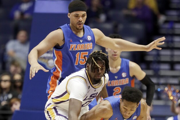 LSU forward Naz Reid (0) knocks the ball out of the control of Florida guard KeVaughn Allen (5) in the first half of an NCAA college basketball game at the Southeastern Conference tournament Friday, March 15, 2019, in Nashville, Tenn. (AP Photo/Mark Humphrey)