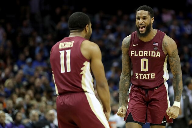 CHARLOTTE, NORTH CAROLINA - MARCH 15: Teammates Phil Cofer #0 and David Nichols #11 of the Florida State Seminoles react against the Virginia Cavaliers during their game in the semifinals of the 2019 Men's ACC Basketball Tournament at Spectrum Center on March 15, 2019 in Charlotte, North Carolina.  (Photo by Streeter Lecka/Getty Images)