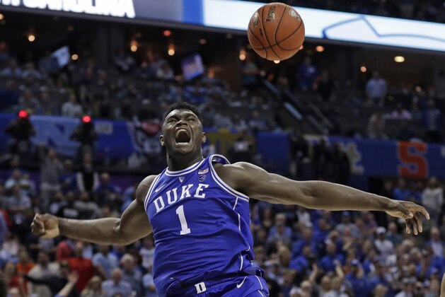 Duke's Zion Williamson (1) reacts after a dunk against North Carolina during the second half of an NCAA college basketball game in the Atlantic Coast Conference tournament in Charlotte, N.C., Friday, March 15, 2019. (AP Photo/Nell Redmond)