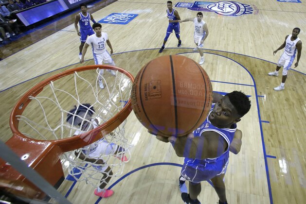 Duke's Zion Williamson drives to the basket against North Carolina during the second half of an NCAA college basketball game in the Atlantic Coast Conference tournament in Charlotte, N.C., Saturday, March 16, 2019. (AP Photo/Chuck Burton)