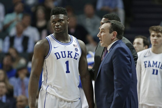 Duke's Zion Williamson (1) talks with head coach Mike Krzyzewski, right, during the second half of an NCAA college basketball game against Syracuse in the Atlantic Coast Conference tournament in Charlotte, N.C., Thursday, March 14, 2019. (AP Photo/Nell Redmond)