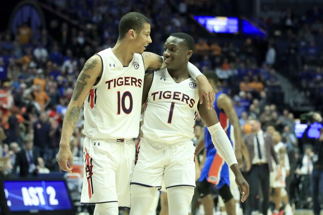 NASHVILLE, TENNESSEE - MARCH 16:   Jared Harper #1 of the Auburn Tigers celebrates with Samir Doughty #10 after making a three point basket against the Florida Gators during the semifinals of the SEC Basketball Tournament at Bridgestone Arena on March 16, 2019 in Nashville, Tennessee. (Photo by Andy Lyons/Getty Images)