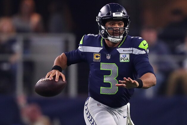 ARLINGTON, TEXAS - JANUARY 05: Russell Wilson #3 of the Seattle Seahawks looks for an open receiver against the Dallas Cowboys during the Wild Card Round at AT&T Stadium on January 05, 2019 in Arlington, Texas. (Photo by Tom Pennington/Getty Images)