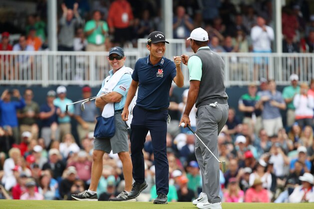 PONTE VEDRA BEACH, FLORIDA - MARCH 16:   Kevin Na of the United States reacts with Tiger Woods of the United States on the 17th green during the third round of The PLAYERS Championship on The Stadium Course at TPC Sawgrass on March 16, 2019 in Ponte Vedra Beach, Florida. (Photo by Gregory Shamus/Getty Images)