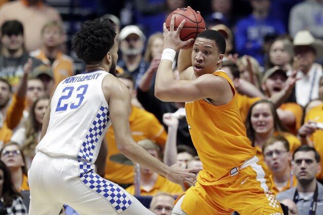 Tennessee's Grant Williams, right, protects the ball from Kentucky forward EJ Montgomery (23) in the first half of an NCAA college basketball game at the Southeastern Conference tournament Saturday, March 16, 2019, in Nashville, Tenn. (AP Photo/Mark Humphrey) Tennessee's Grant Williams, right, protects the ball from Kentucky forward EJ Montgomery (23) in the first half of an NCAA college basketball game at the Southeastern Conference tournament Saturday, March 16, 2019, in Nashville, Tenn. (AP Photo/Mark Humphrey)