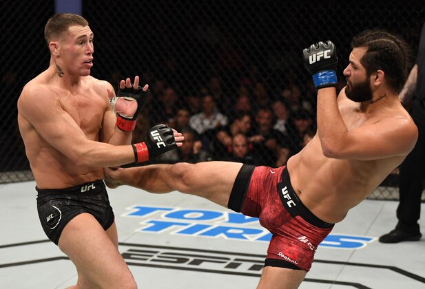 LONDON, ENGLAND - MARCH 16:  (R-L) Jorge Masvidal kicks Darren Till of England in their welterweight bout during the UFC Fight Night event at The O2 Arena on March 16, 2019 in London, England. (Photo by Jeff Bottari/Zuffa LLC/Zuffa LLC via Getty Images)
