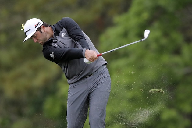Jon Rahm, of Spain, takes a divot as he hits on the 14th fairway during the third round of The Players Championship golf tournament Saturday, March 16, 2019, in Ponte Vedra Beach, Fla. (AP Photo/Gerald Herbert)