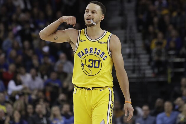 Golden State Warriors guard Stephen Curry (30) gesutres against the Phoenix Suns during the second half of an NBA basketball game in Oakland, Calif., Sunday, March 10, 2019. (AP Photo/Jeff Chiu)