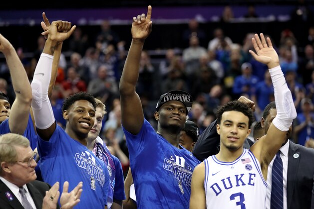 CHARLOTTE, NORTH CAROLINA - MARCH 16: Teammates Zion Williamson #1, RJ Barrett #5, and Tre Jones #3 of the Duke Blue Devils react after defeating the Florida State Seminoles 73-63 in the championship game of the 2019 Men's ACC Basketball Tournament at Spectrum Center on March 16, 2019 in Charlotte, North Carolina. (Photo by Streeter Lecka/Getty Images)