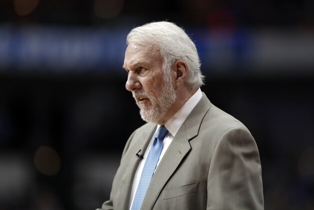 San Antonio Spurs coach Gregg Popovich watches play in the closing minutes of the team's NBA basketball game against the Dallas Mavericks in Dallas, Tuesday, March 12, 2019. (AP Photo/Tony Gutierrez)