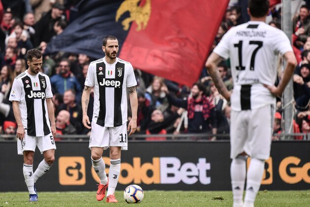 Juventus' Bosnian midfielder Miralem Pjanic (L) and Juventus' Italian defender Leonardo Bonucci (C) react after Juventus conceded a goal during the Italian Serie A football Match Genoa vs Juventus on March 17, 2019 at the Luigi-Ferraris stadium in Genoa. (Photo by Marco BERTORELLO / AFP)        (Photo credit should read MARCO BERTORELLO/AFP/Getty Images)
