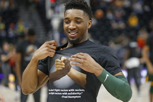 Utah Jazz guard Donovan Mitchell wears a solidarity T-shirt, during warm-ups before the start of their NBA basketball game against the Brooklyn Nets Saturday, March 16, 2019, in Salt Lake City. (AP Photo/Rick Bowmer)